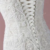 Pearled lace wedding gown with a lace up closure 5